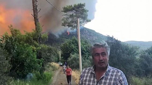 CHP Köyceğiz İlçe Başkanı Hüseyin Erol yangın bölgesinde alevlerin arasında yaptığı açıklamada acil tahliye için araç lazım olduğunu söyledi.